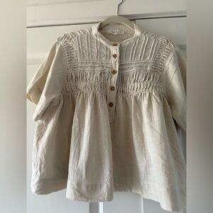 Solitaire pleated boho-style blouse.